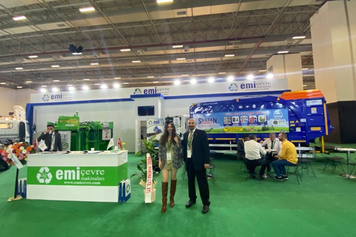 Sustainable energy exhibition stand with illuminated branding, technology displays and open meeting areas